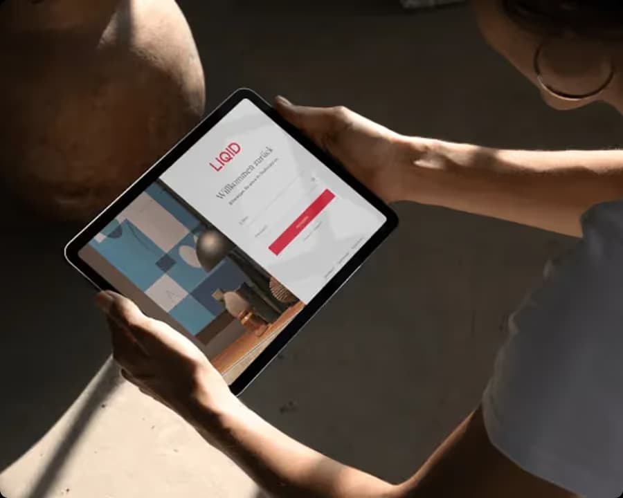 Tablet showing a login screen held in low light